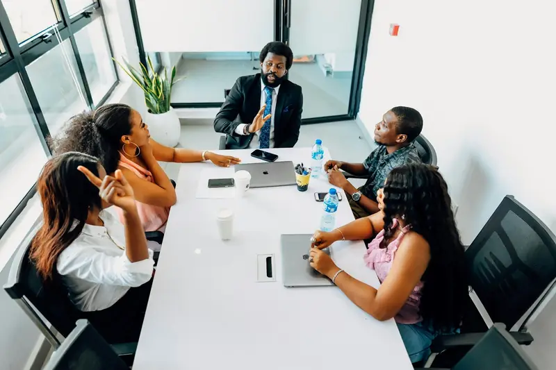 A team discussing operations in a meeting room