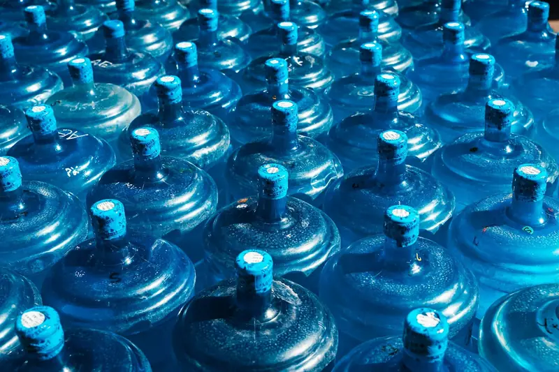 Rows of bottled water jugs ready for delivery